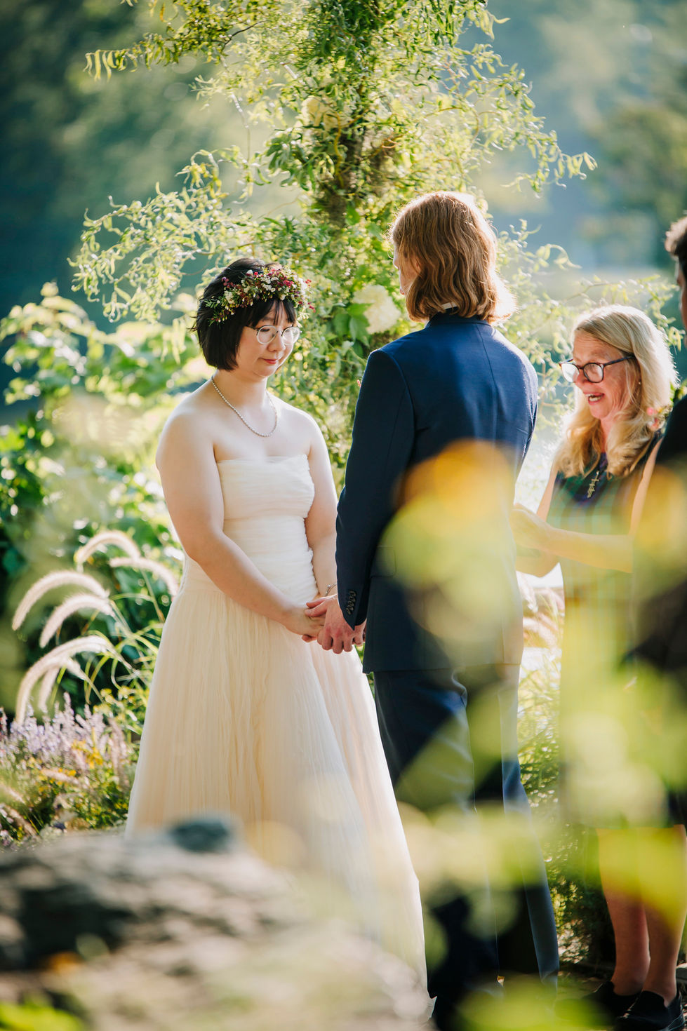 Bride and groom surrounded by florals