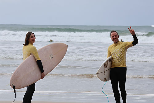 25.5.8_AW 3B Dane & Penny on beach with boards.JPG