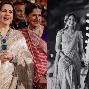 A grand Indian wedding celebration. On the left, an older man and two women in rich traditional clothes and heavy jewellery laugh joyfully among guests. On the right, a young couple in embroidered wedding outfits walk hand in hand under glowing lights. The lavish setting shows the wedding extravaganza culture discussed in this article.