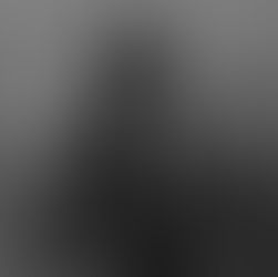 A grayscale digital painting of Ravana as a powerful warrior king in dark, ornate armour, standing against a smoky gray background, representing the pride and power that Noida’s modern “chariots” and boardrooms still echo.