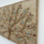 Thumbnail: A colorful dimensional tree painting with lots of sparkling leaves and raised trunk and branches gilded in gold
