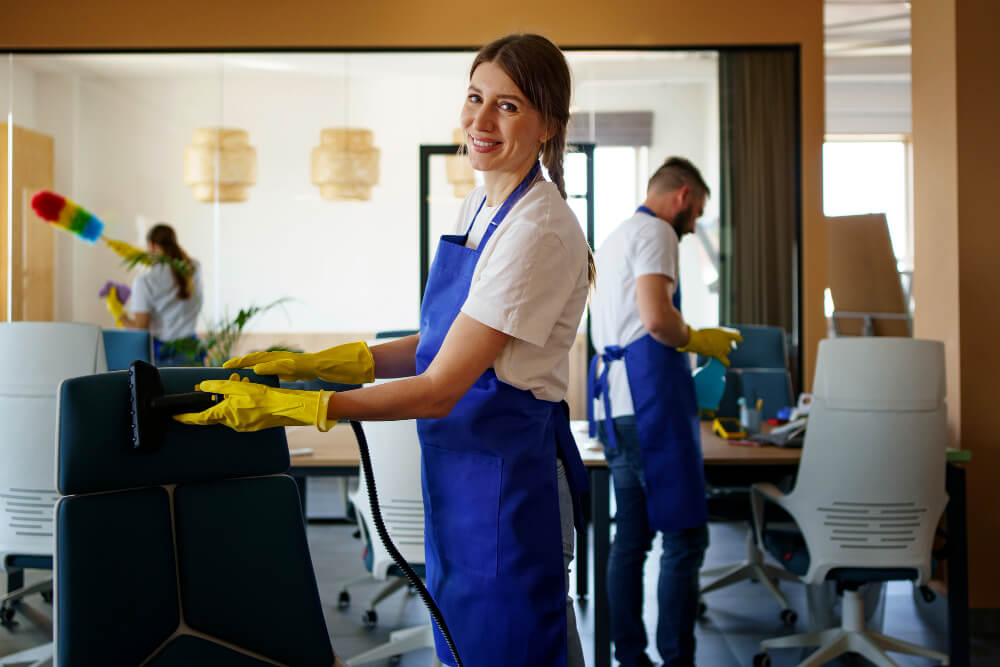 professional two women cleaning the executive office room