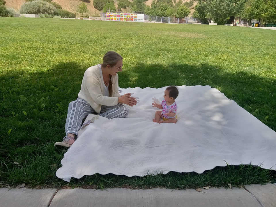 Many_Mothers_Volunteer Mary Beth w baby.jpeg