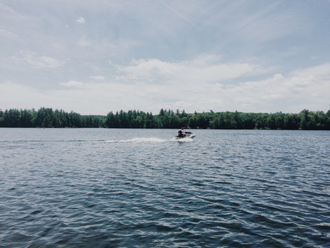 view-of-friends-jet-skiing-on-a-lake-in-the-summer-2021-08-31-20-04-52-utc.jpg