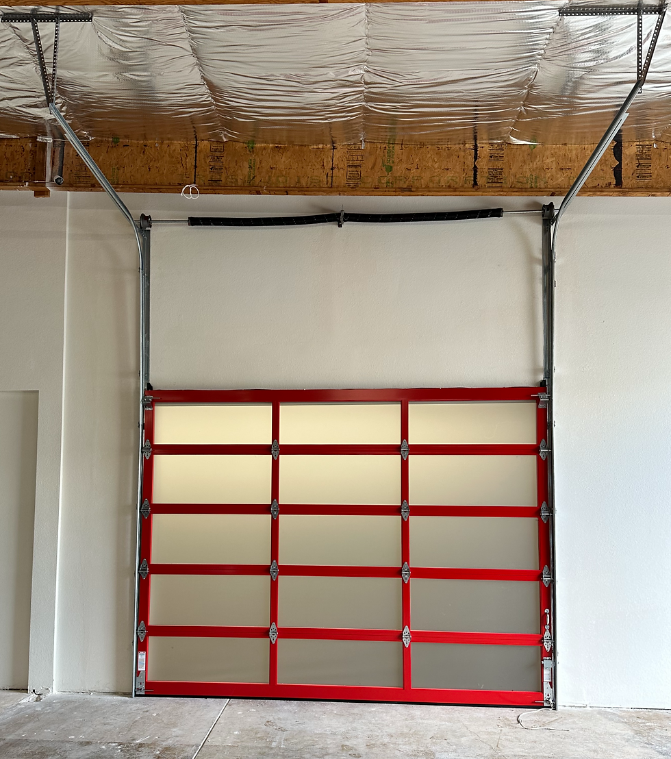 Close-up view of garage door tracks and springs being installed