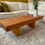 Thumbnail: Handcrafted pine wood coffee table with sleek metal or wooden legs, blending rustic charm with contemporary design.