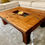 Thumbnail: Lightweight farmhouse coffee table with a natural wood tone.