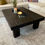 Thumbnail: Lightweight farmhouse coffee table with a dark rustic wood tone from wood-burning.