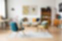 stylish-vintage-furniture-spacious-flat-interior-with-beige-sofa-chairs-posters-wall.png