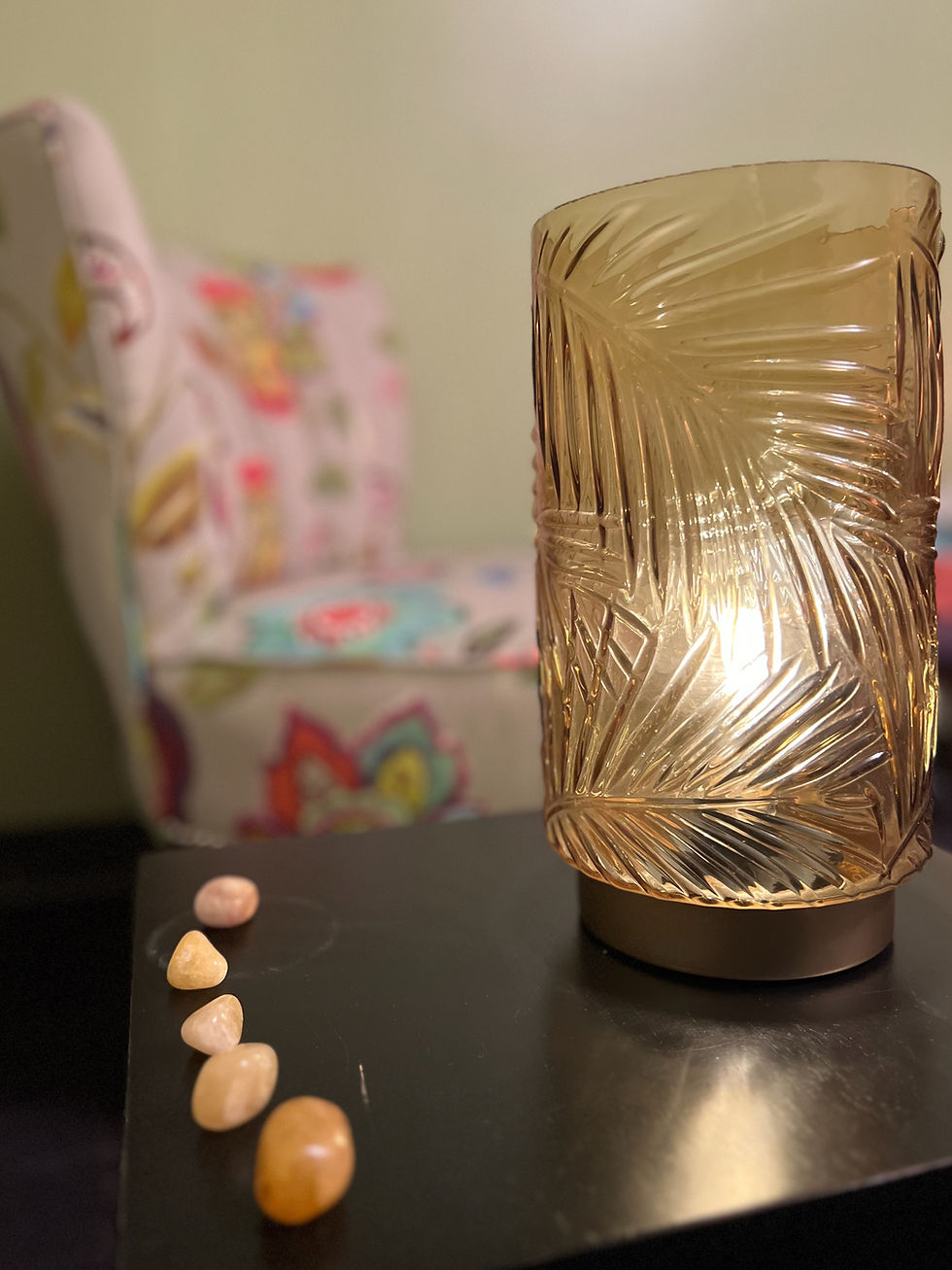 lamp with small stones on table
