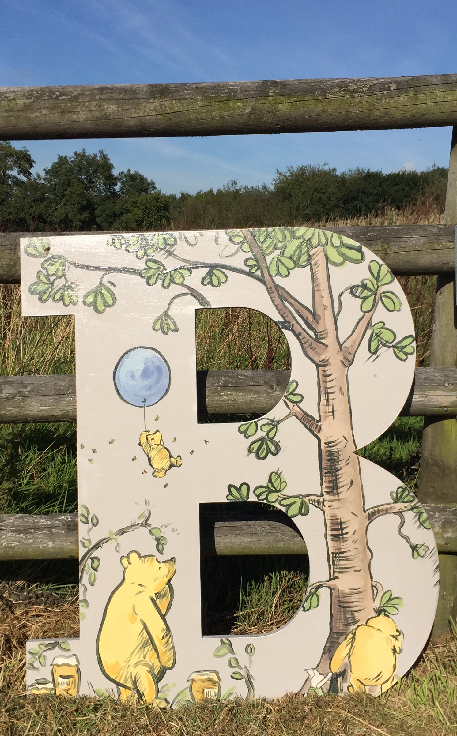 B in classic Winnie the Pooh design