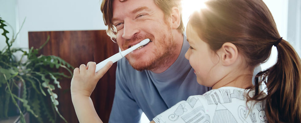 Girl Brushing Dad's Teeth