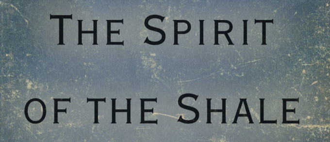 A close-up of the cover for "The Spirit of the Shale" game used in Roll Your Destiny's 2024 Tennessee Ren Fest game. The name is printed in black text on a worn ice-blue journal cover.