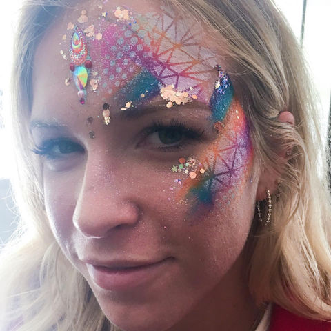 Woman with shiny and colorful face painting design at corporate event in the Bay Area