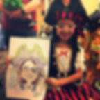 Girl in pirate costume holding full-color caricature of herself by HappyCake Face Painter, Caricatur