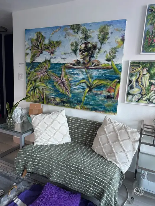 Goddess of the Water painting displayed above a bed in a contemporary bedroom.