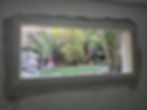 New window opening with a garden view in a basement unit, Beit Shemesh