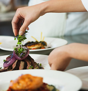 Chefs Garnishing Plates