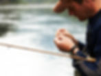 Man Tying Fishing Line