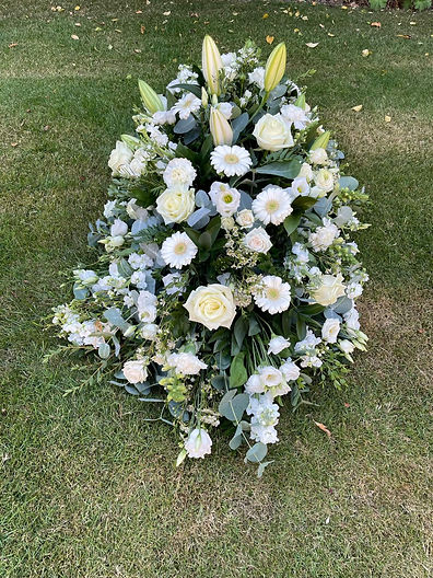 Coffin tribute, white flowers