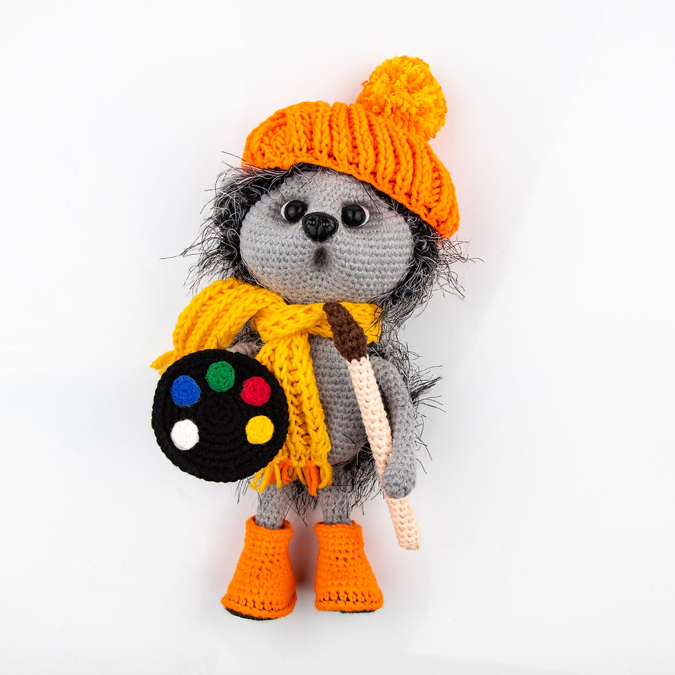 Funny knitted toy hedgehog on a white background Amigurumi toy Crochet stuffed animals.jp