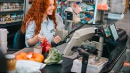 In Lille, a commercial shop has a student cashier who collects money from customers.