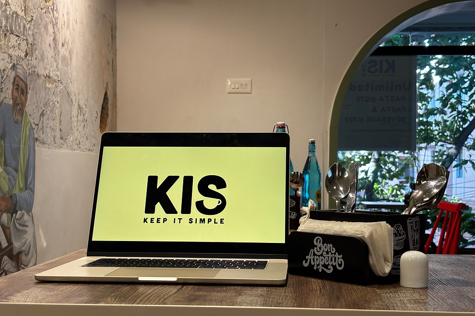 laptop on table showing kis cafe