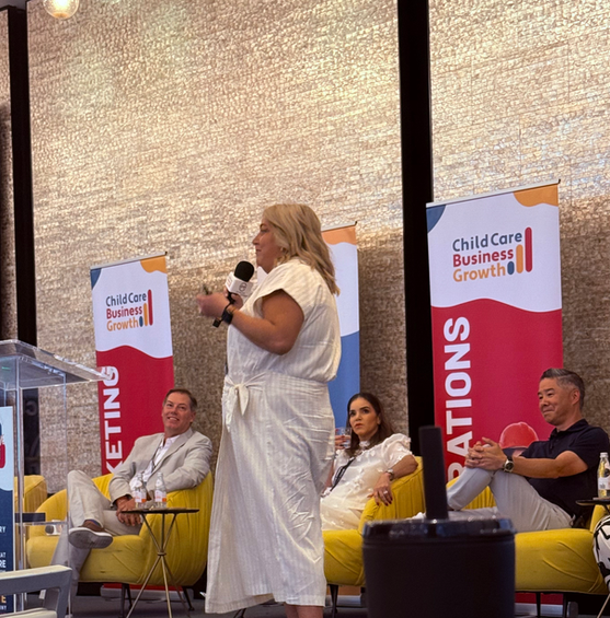 Jessica Hampton speaking on stage at a childcare business conference