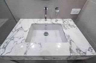 Elegant marble vanity with an undermount sink in a contemporary bathroom renovation by Elite Makeovers Perth. Bathroom Renovation located in Claremont. 