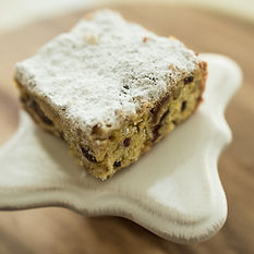 Date bar with powdered sugar dusting