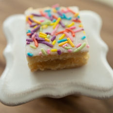 pineapple bar with white icing and colorful sprinkles