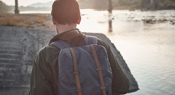 Rear View of Man with Backpack