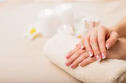 French manicure hands on a towel