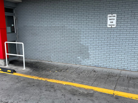 House with monotone painted brick exterior showing flat, uniform brick color.