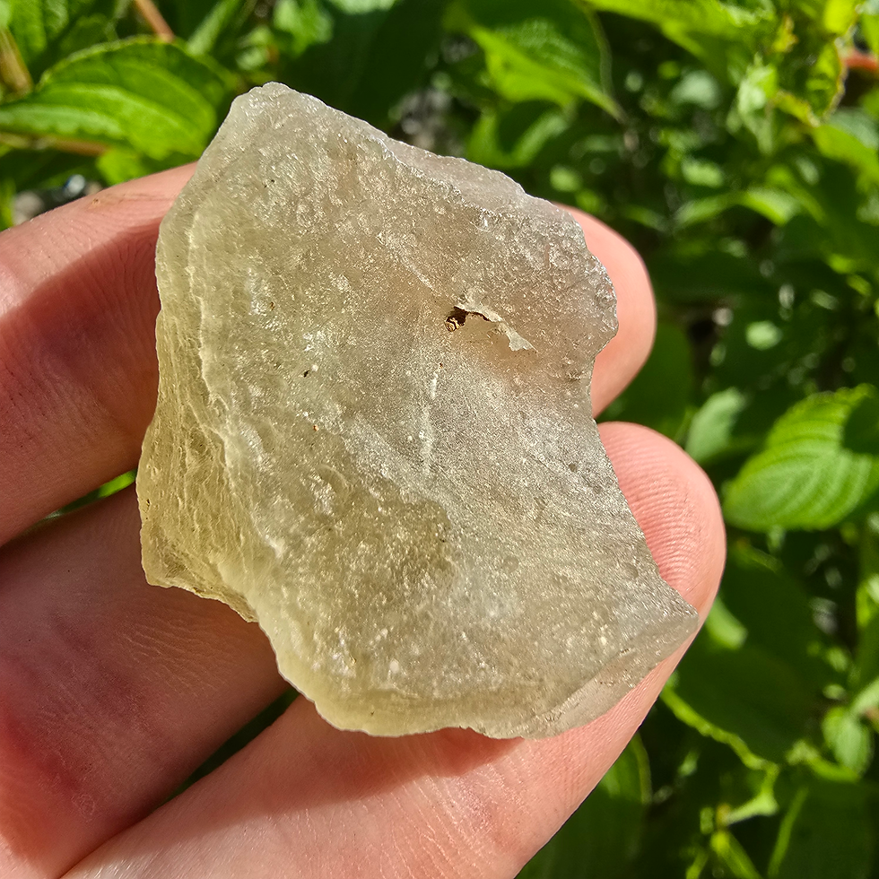 Thumbnail: Raw Libyan Desert Glass held in hand