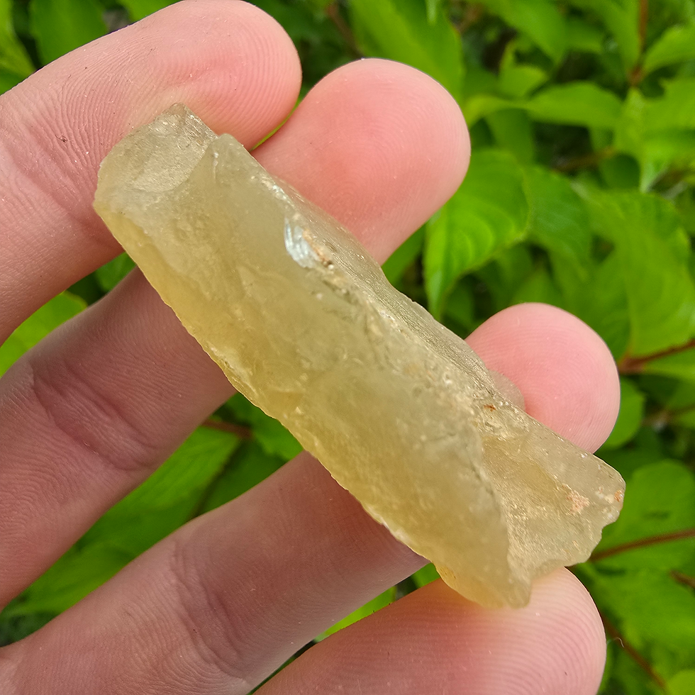 Thumbnail: Raw Libyan Desert Glass held in hand