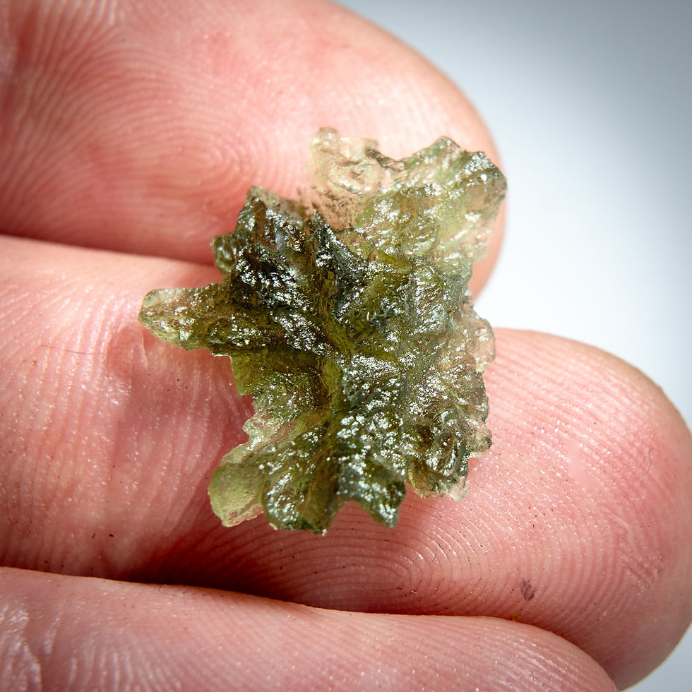 Thumbnail: Libyan Desert Glass, 8.25g, held in hand
