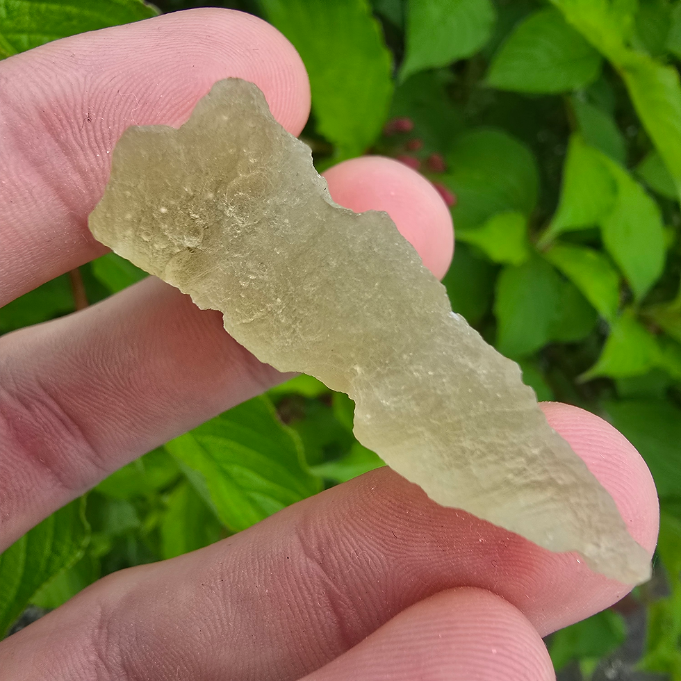 Thumbnail: Libyan Desert Glass held in hand