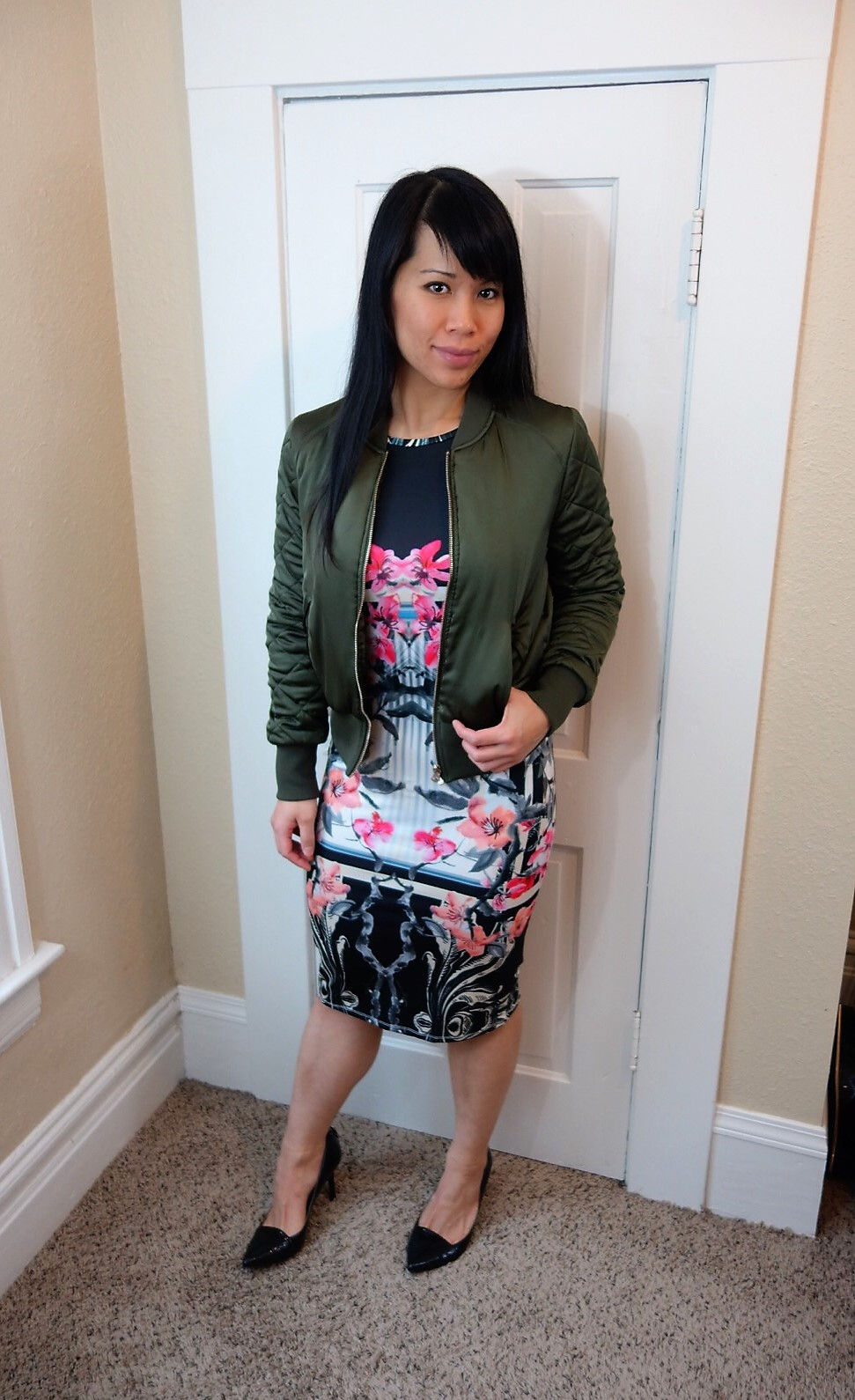 Kat Depner wearing a bomber with a bodycon dress for date night