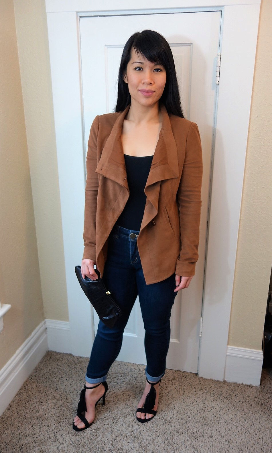 Kat Depner wearing waterfall jacket with clutch for date night
