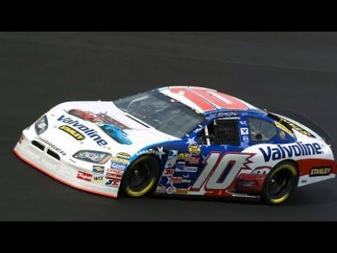 Race car with a vibrant blue, red, and white Valvoline livery, number 10, speeding on a track. Logos and decals cover the car.