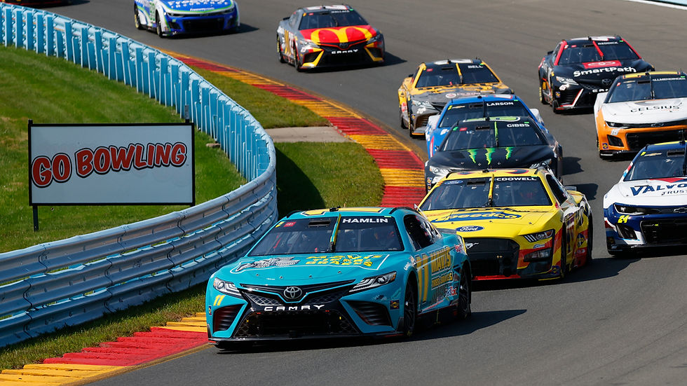Race cars speed around a track with "GO BOWLING" sign visible. Bright colors and intense action create a competitive atmosphere.