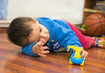 Toddler with ASD plays quietly