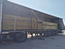 round-wood-poles-commercial-order-loaded-truck