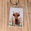 Thumbnail: Highland cow keychain with wildflowers