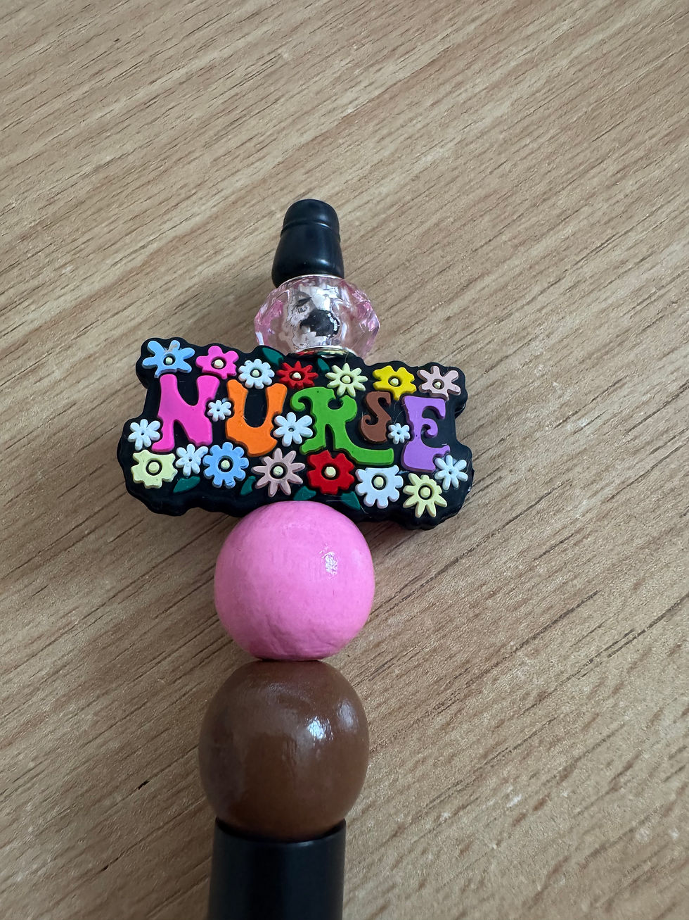 Nurse charm with flowers and beads