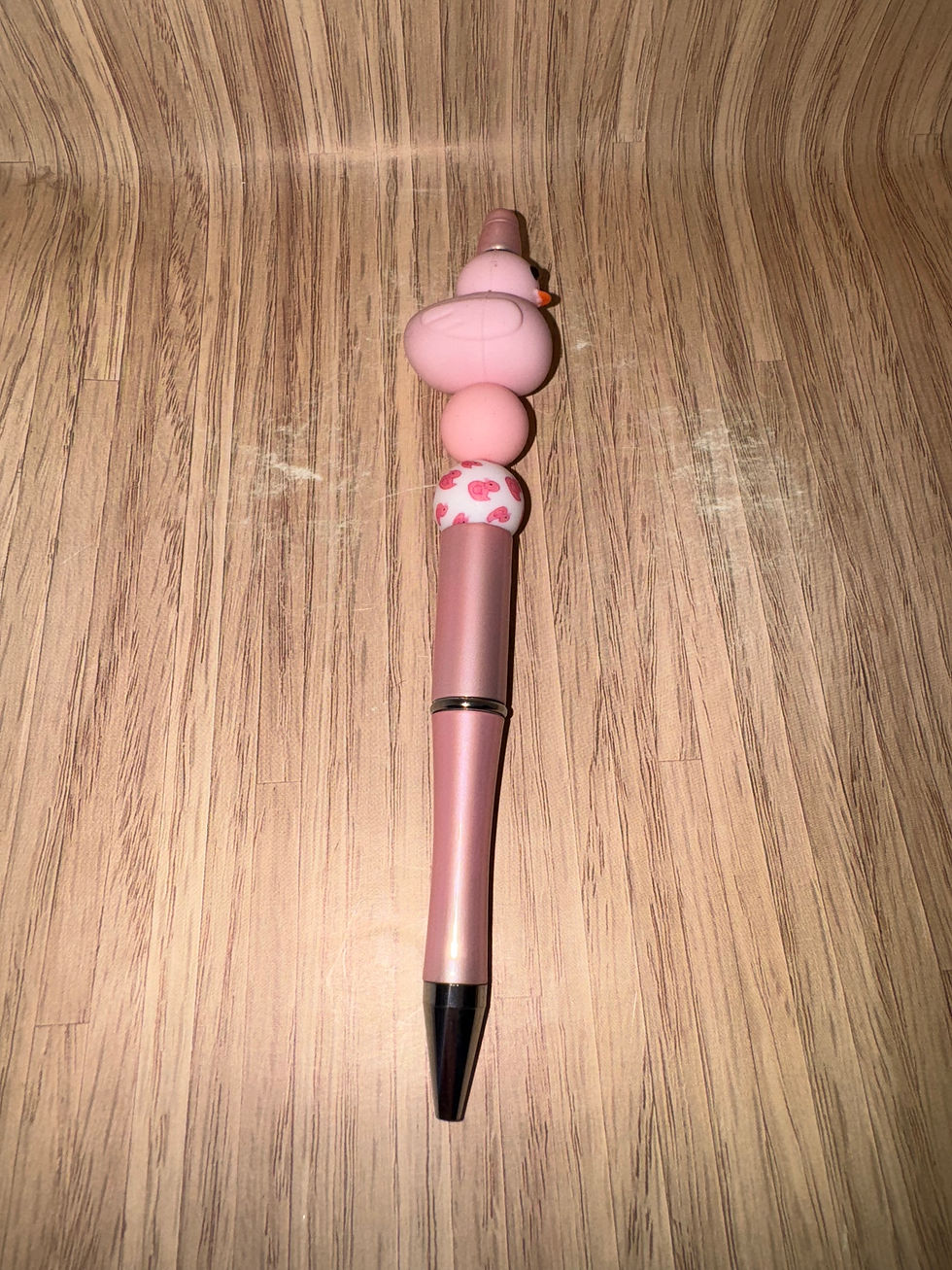 Pink pen with cute duck charm