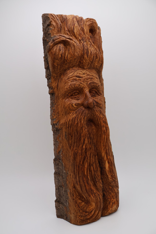 wood spirit in hand-carved in cottonwood bark