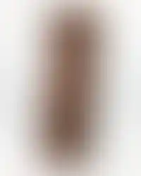 a sculpture of a bearded male face carved into a piece of wood