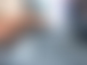 A close up image of a laptop with a person's hands typing on the keyboard.